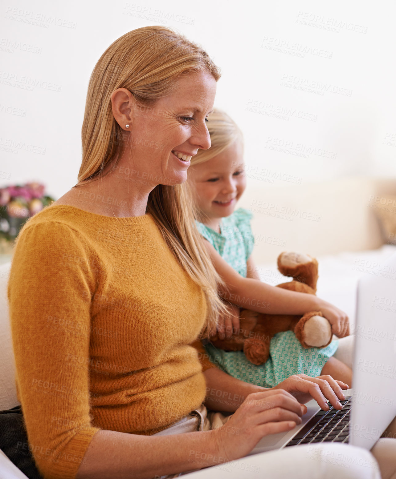 Buy stock photo Happy mother, child and relax with laptop on sofa for online entertainment, social media or networking at home. Mom, kid or daughter with smile on technology for streaming or subscription at house