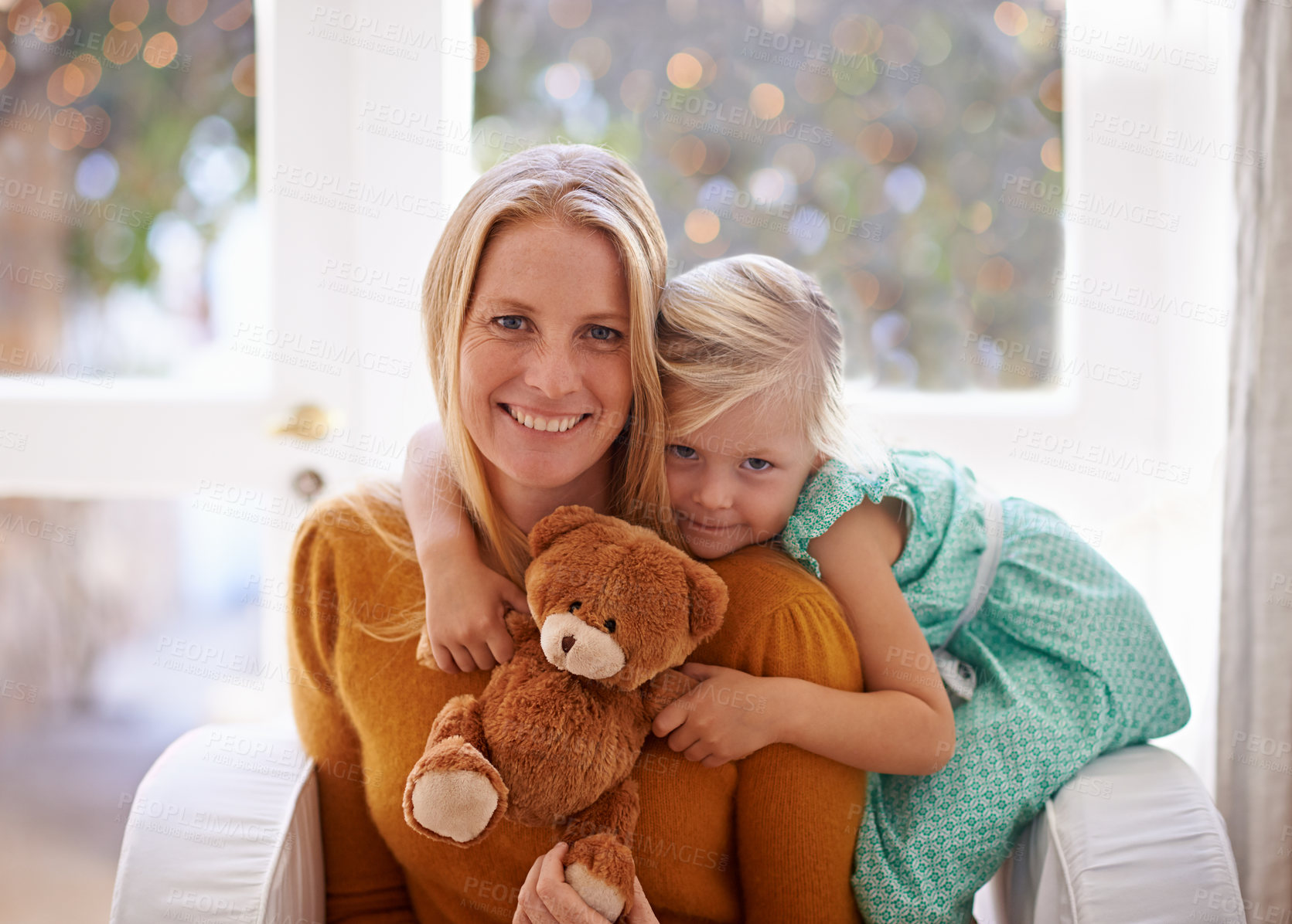 Buy stock photo Happy mama, portrait and hug with child or teddy bear for love, care or support together in living room at home. Face of mom, kid or daughter with smile for embrace, affection or mothers day at house