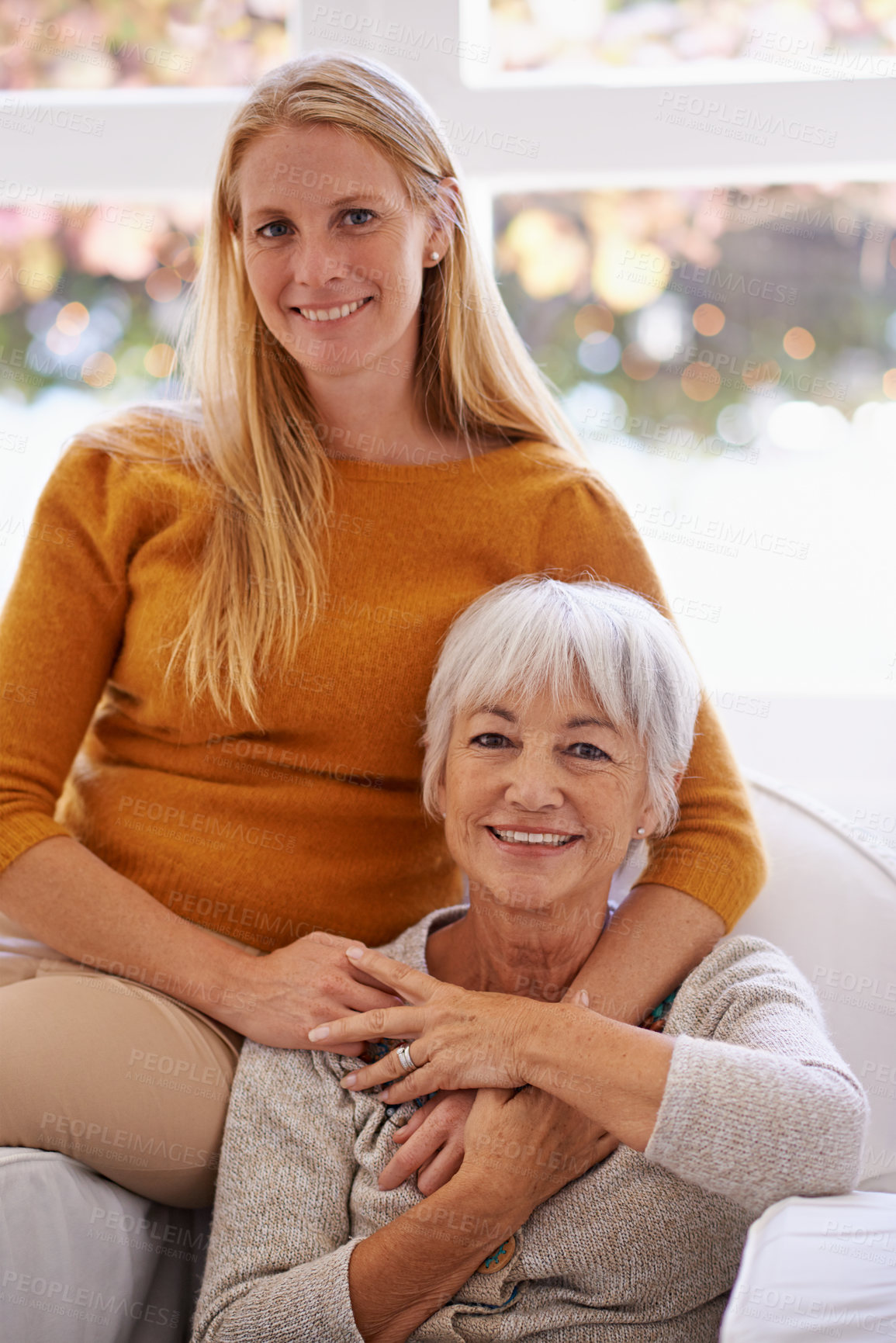 Buy stock photo Senior mother, daughter and home with smile on sofa for bonding to relax, visit and break together. Portrait, parent and mom with happiness in living room for love, hug and satisfied as family. 