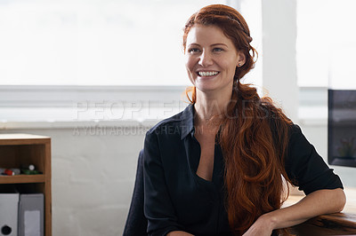 Buy stock photo Portrait of a beautiful young businesswoman sitting at her desk