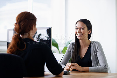 Buy stock photo Interview, recruitment and happy business women in office in conversation, talking and chat at desk. Communication, partnership and female workers with documents for meeting, hiring and collaboration