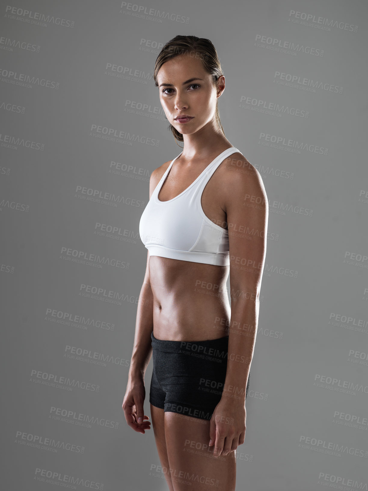 Buy stock photo Shot of an attractive athletic woman wearing workout clothes