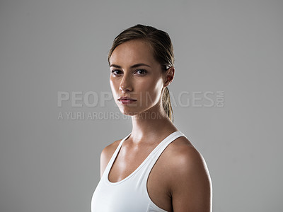 Buy stock photo Cropped shot of an attractive brunette looking confident about her upcoming workout