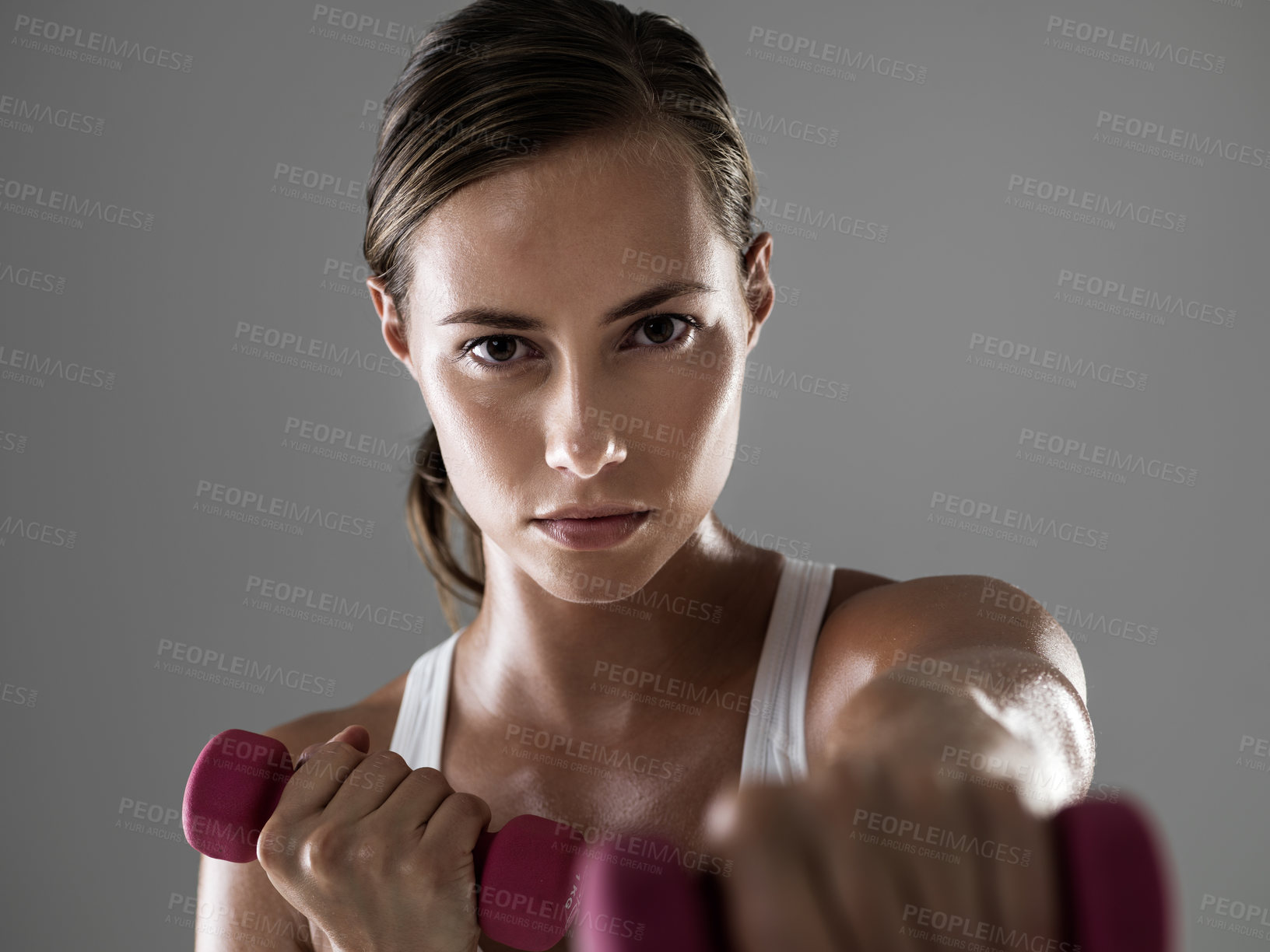 Buy stock photo Serious woman, portrait and fitness with dumbbells for weightlifting, workout or exercise on a gray studio background. Female person, bodybuilder or athlete with small barbells for training on mockup