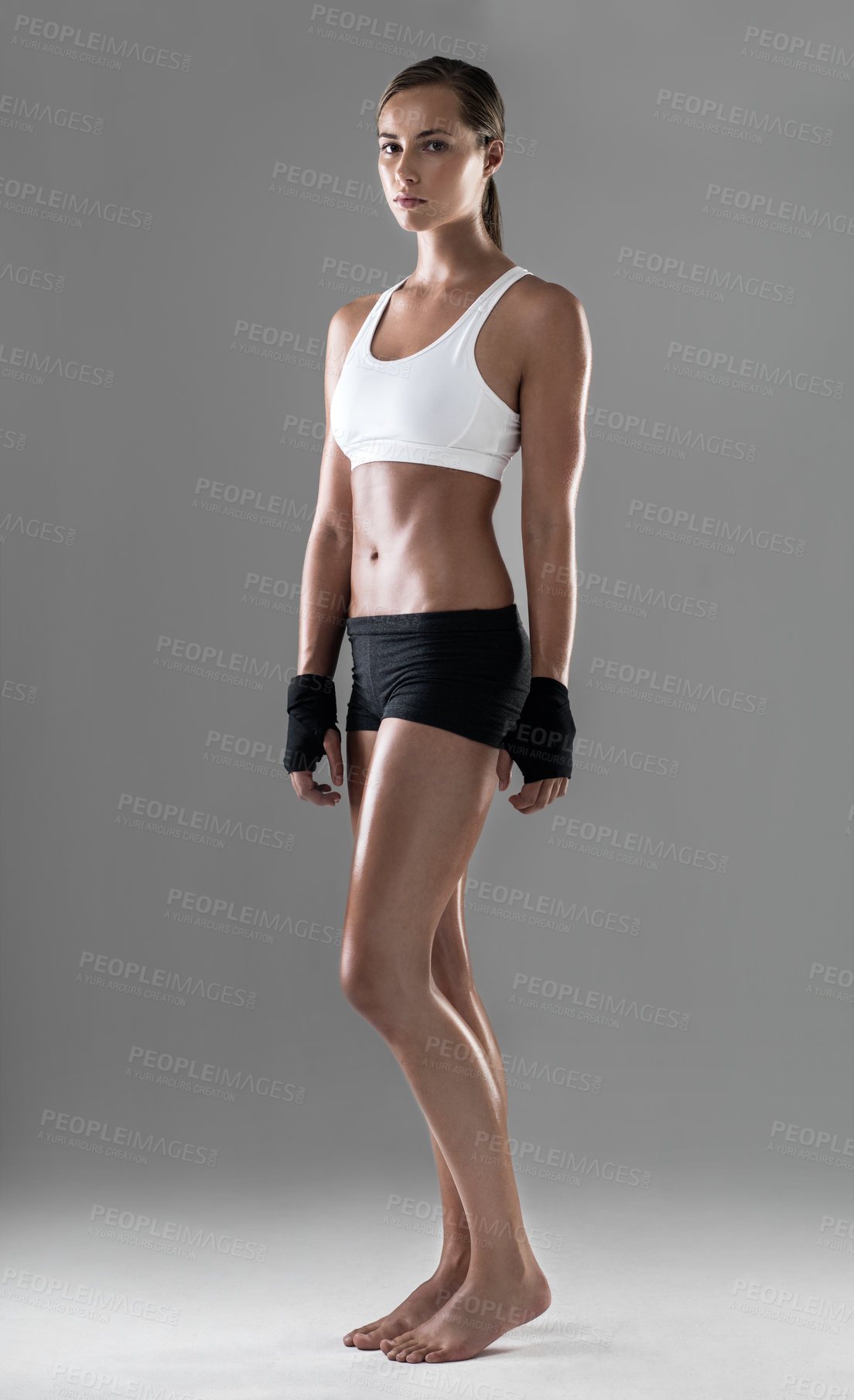 Buy stock photo Woman, six pack with body and kickboxing for exercise, strong with muscle and sweat from workout on grey background. Boxing, self defense training and athlete for sports, fitness and power in studio