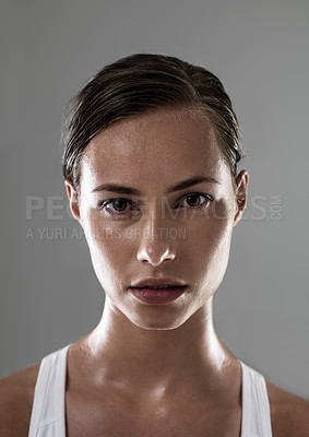 Buy stock photo Woman, serious face and confident for fitness, strong and determined with sweat from workout on grey background. Headshot, portrait and athlete for sports, exercise with pride and power in studio