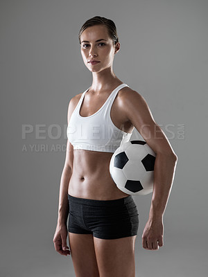 Buy stock photo Woman, portrait and soccer player with ball for match, game or kick off on a gray studio background. Female person or athlete with football for sports exercise, workout or training on mockup space