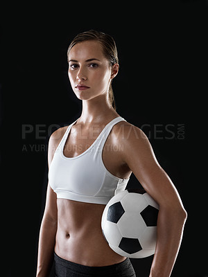 Buy stock photo Portrait of an athletic young woman ready to play a game of football