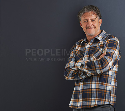 Buy stock photo A portrait of a happy mature man standing against a grey background