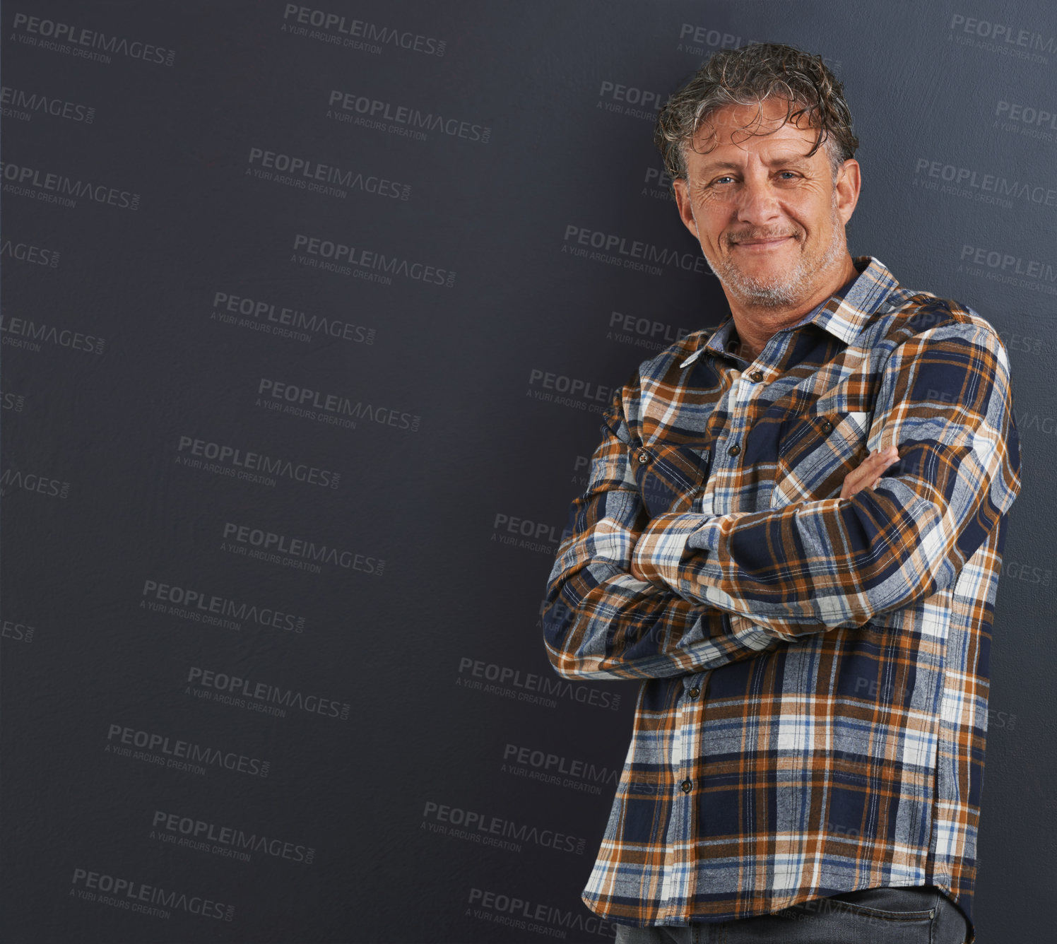 Buy stock photo A portrait of a happy mature man standing against a grey background