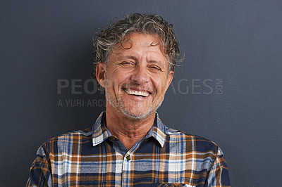 Buy stock photo Mature, man and happy portrait in studio on dark background with fashion or casual style. Confident, person and smile on face with pride or guy relax on mockup space with plaid pattern on shirt