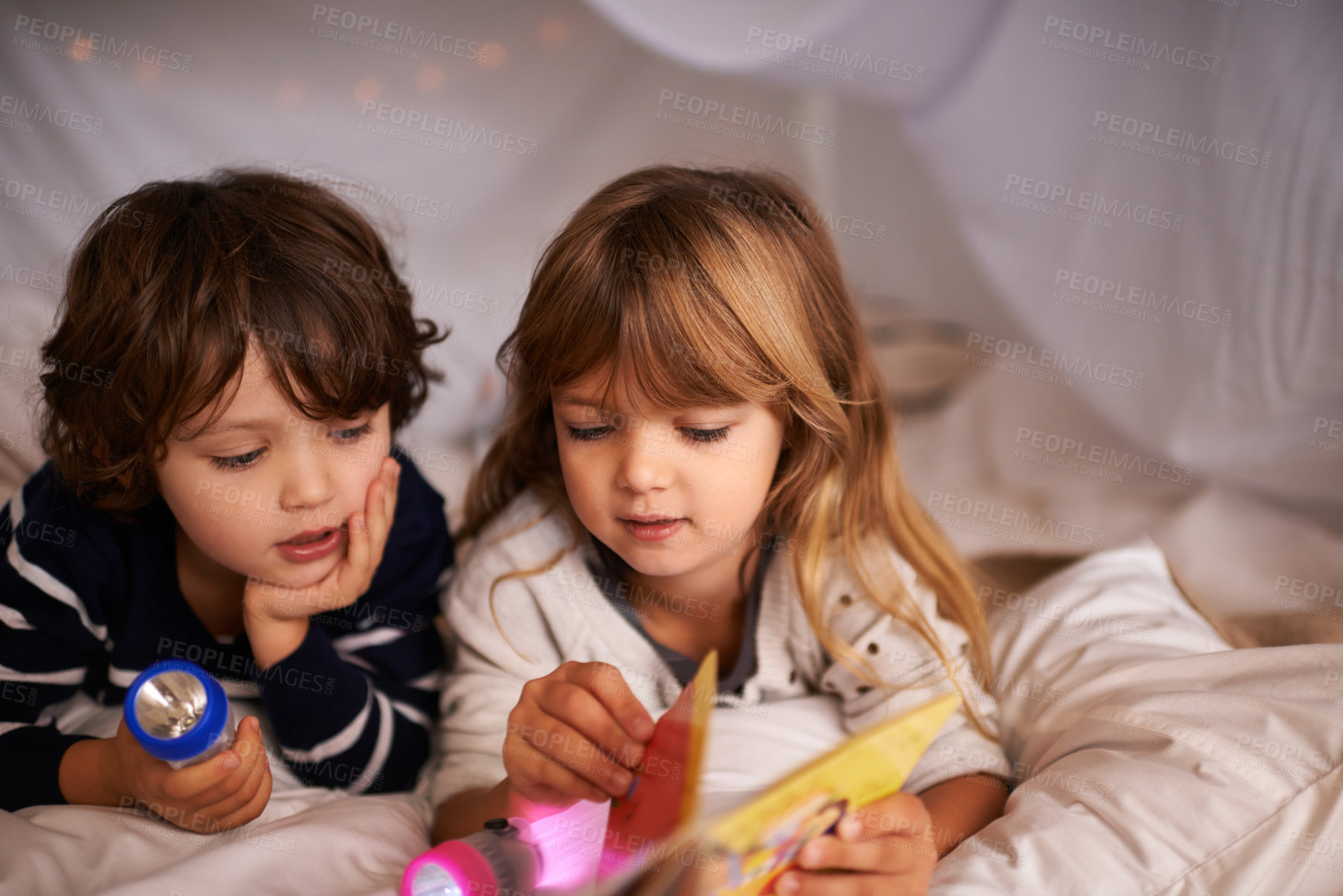 Buy stock photo Reading, blanket fort and children with book for knowledge, learning and education with flashlight. Bonding, relaxing and young kids enjoying story or novel together in tent for sleepover at home.