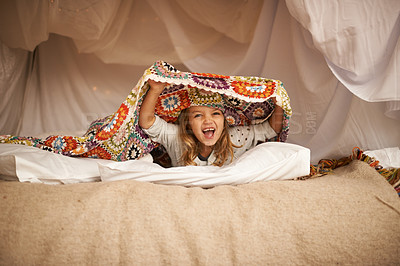 Buy stock photo Happy, blanket fort and portrait of child relaxing and playing hide and seek with quilt at home. Excited, smile and face of girl kid with positive, good and playful expression in bedroom at house.