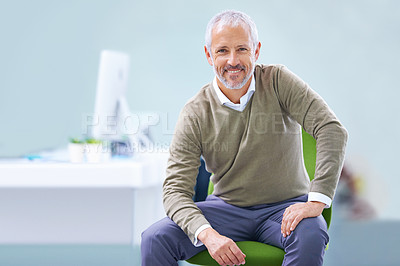 Buy stock photo Portrait of a mature businessman sitting on his office chair
