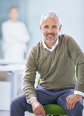 Buy stock photo Portrait of a mature businessman sitting on his office chair