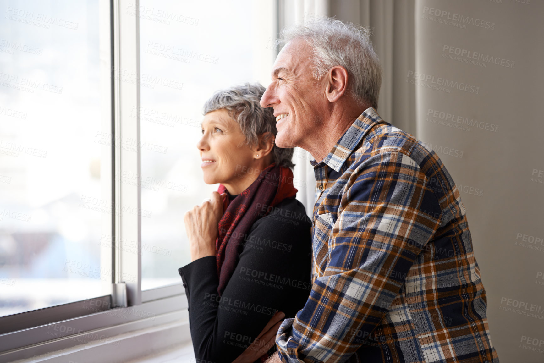 Buy stock photo Mature couple, man and woman in window of house, home and retirement holiday with happiness. Smile, elderly people and marriage for bonding, commitment and love in vacation for female and male person