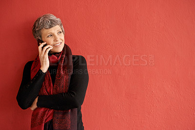 Buy stock photo Mature woman, phone call and smile by wall with space for mockup, communication and listen by red background. Senior lady, smartphone and think of idea in mock up for chat, networking and talking