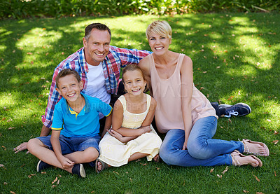 Buy stock photo Happy, portrait and family in garden of home with love and gratitude for parents and children. Mother, father and kids smile in backyard on holiday or vacation in summer and relax together on grass