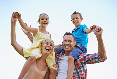 Buy stock photo Portrait, parents and carrying children in park, shoulders and quality time in nature. Love, smile and joyful with happy mother and father on holiday relax, spring or carefree with family on vacation