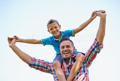 Buy stock photo Dad, young boy and shoulders of parent, sky and outdoors in park with smile. Laugh, love and bonding with son and father with family, spring and carrying child in summer and spending time together