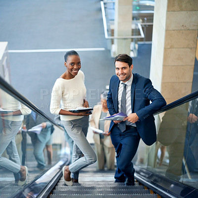 Buy stock photo Teamwork, portrait or business people on escalator for meeting, travel or paperwork in workplace. Diversity, documents and workers planning for collaboration or project together in office with smile