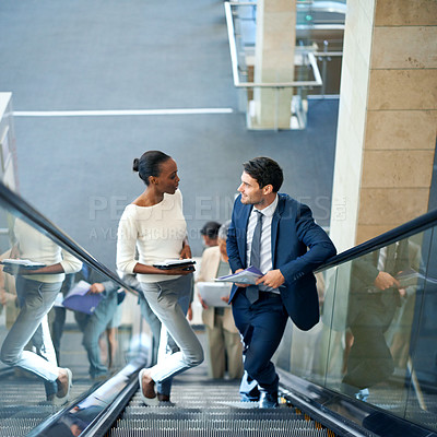 Buy stock photo Teamwork, talking or business people on escalator for meeting, travel or paperwork in workplace. Diversity, documents and workers planning for collaboration or project together in office conversation