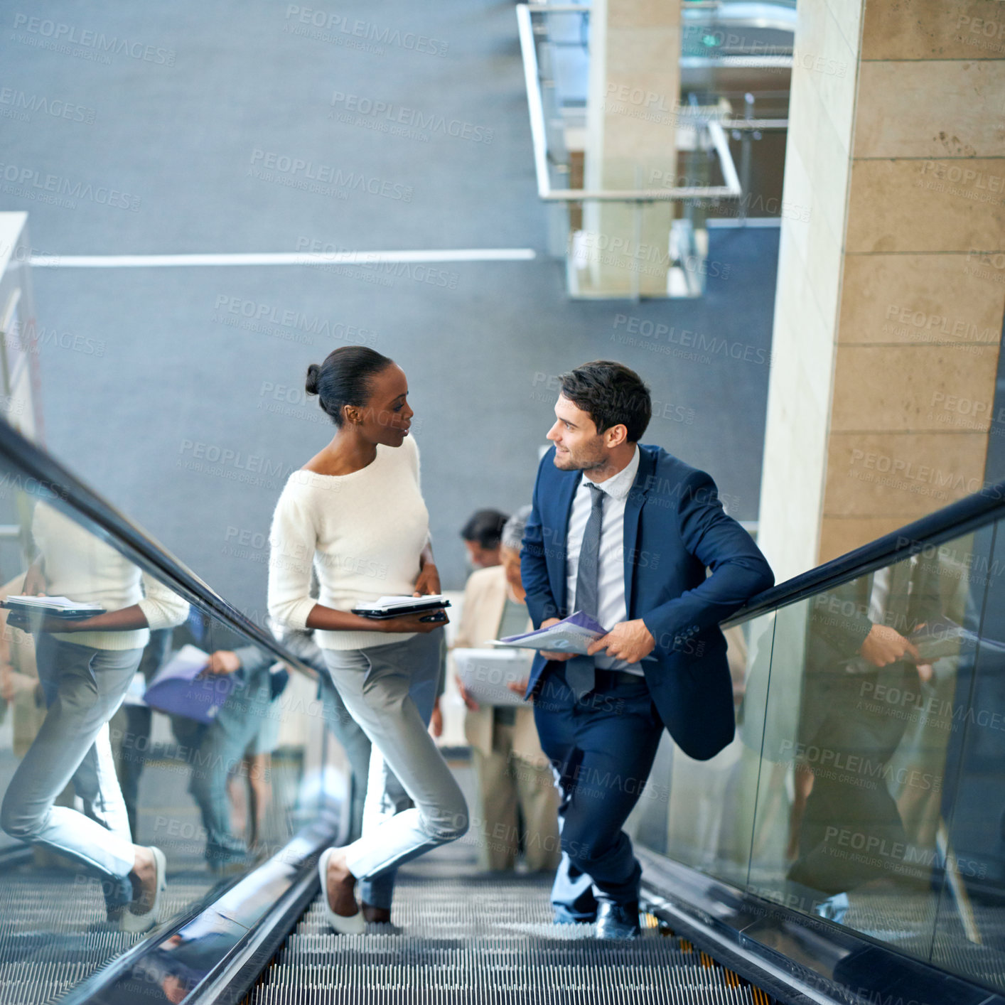 Buy stock photo Teamwork, talking or business people on escalator for meeting, travel or paperwork in workplace. Diversity, documents and workers planning for collaboration or project together in office conversation