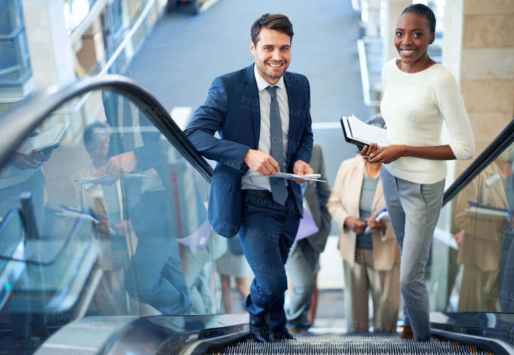 Buy stock photo Teamwork, portrait or business people on escalator for meeting, travel or paperwork in workplace. Diversity, document or happy workers planning for collaboration, report or project together in office