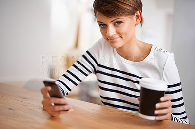 Buy stock photo Phone, smile and portrait of woman with coffee by table networking on social media, mobile app or internet. Happy, technology and female person with cappuccino scroll on cellphone at apartment.