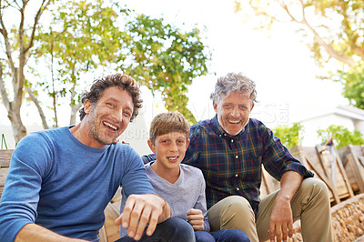 Buy stock photo Boy, dad and grandfather in portrait in backyard with smile, support and outdoor bonding together. Men, family and face of happy child with generations in green garden for nature, weekend and plants