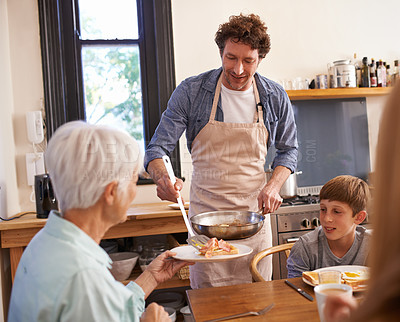 Buy stock photo Mature man, family and child for breakfast at home on happiness in morning, bonding and support for care. Father, food and kitchen for meal to eat in table, enjoy and fun together with grandmother