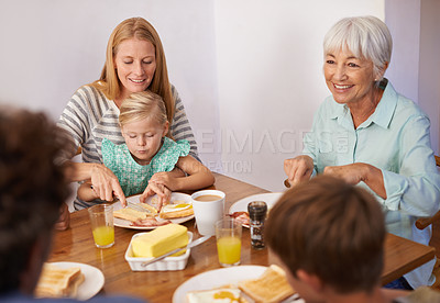 Buy stock photo Family, children and breakfast food with grandmother for healthy nutrition meal, wellness or bonding. Women, eating and daughter at lunch table in apartment for morning connection, brunch or hungry