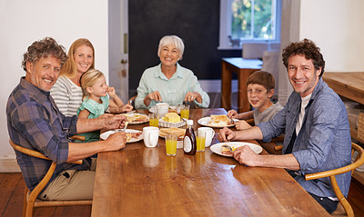 Buy stock photo A portrait of a happy multi-generation family having breakfast together at home