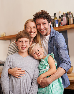 Buy stock photo Family, portrait and hug in kitchen with smile, love and security at home for bonding. Mother, father and children with happiness and affection, people with support and trust for healthy relationship