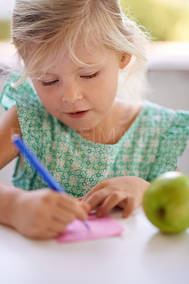 Buy stock photo A cropped shot of a cute little girl drawing on a pink piece of paper