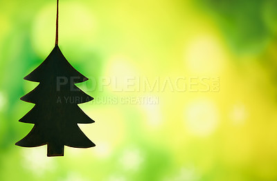 Buy stock photo Christmas, decoration and tree for holiday in studio isolated on a green background mockup space. Xmas, ornament and trinket hanging for festive tradition, party or Christian celebration in December