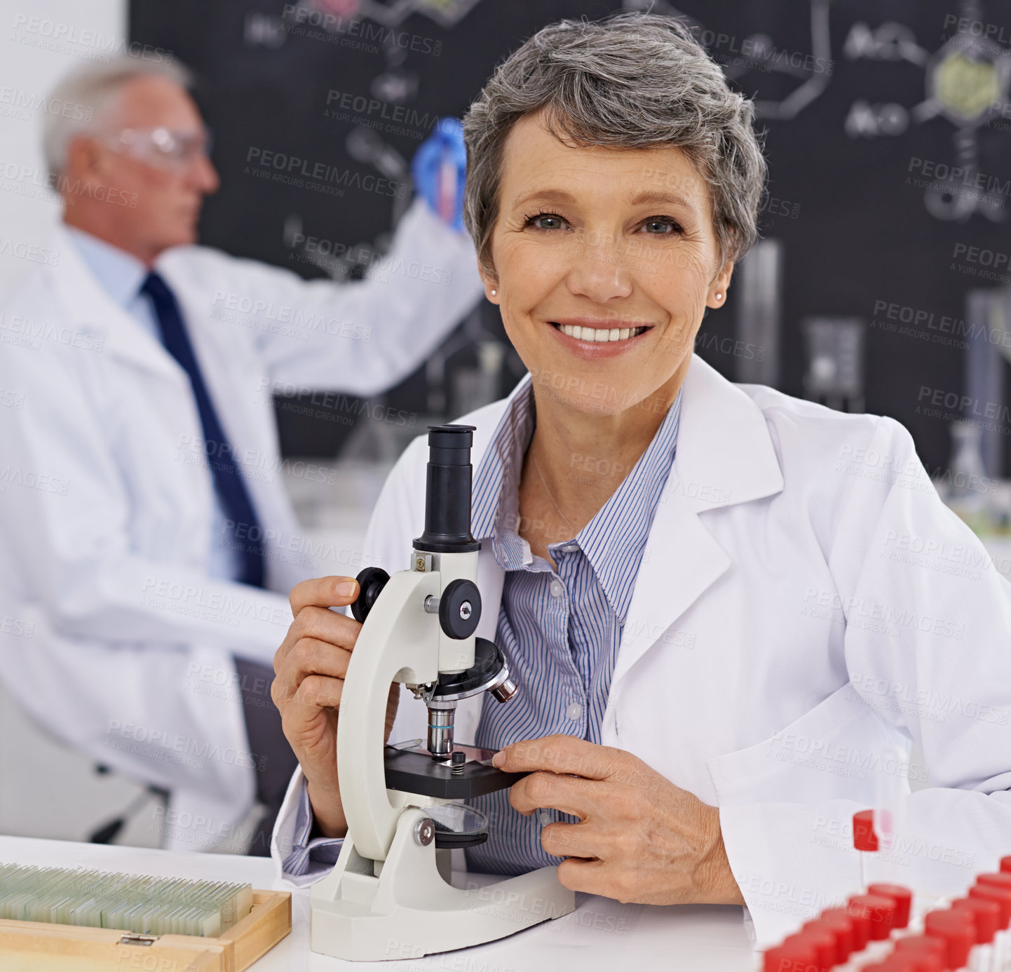 Buy stock photo Shot of a mature female scientist working in a lab