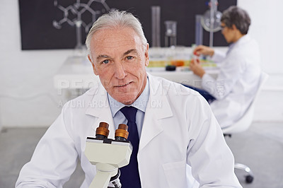 Buy stock photo Shot of a mature scientist working in a lab