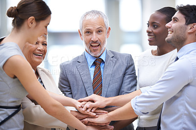 Buy stock photo Portrait, business people and hands together for teamwork, cooperation and solidarity. Group, excited and community huddle of employees for support, mission or collaboration for goal in partnership.