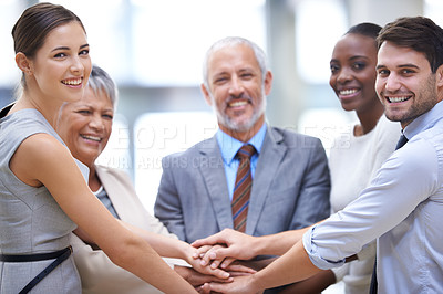 Buy stock photo Portrait, business people and hands together for collaboration, smile and solidarity. Group, teamwork and community huddle of employees for support, mission or cooperation for goal in partnership.