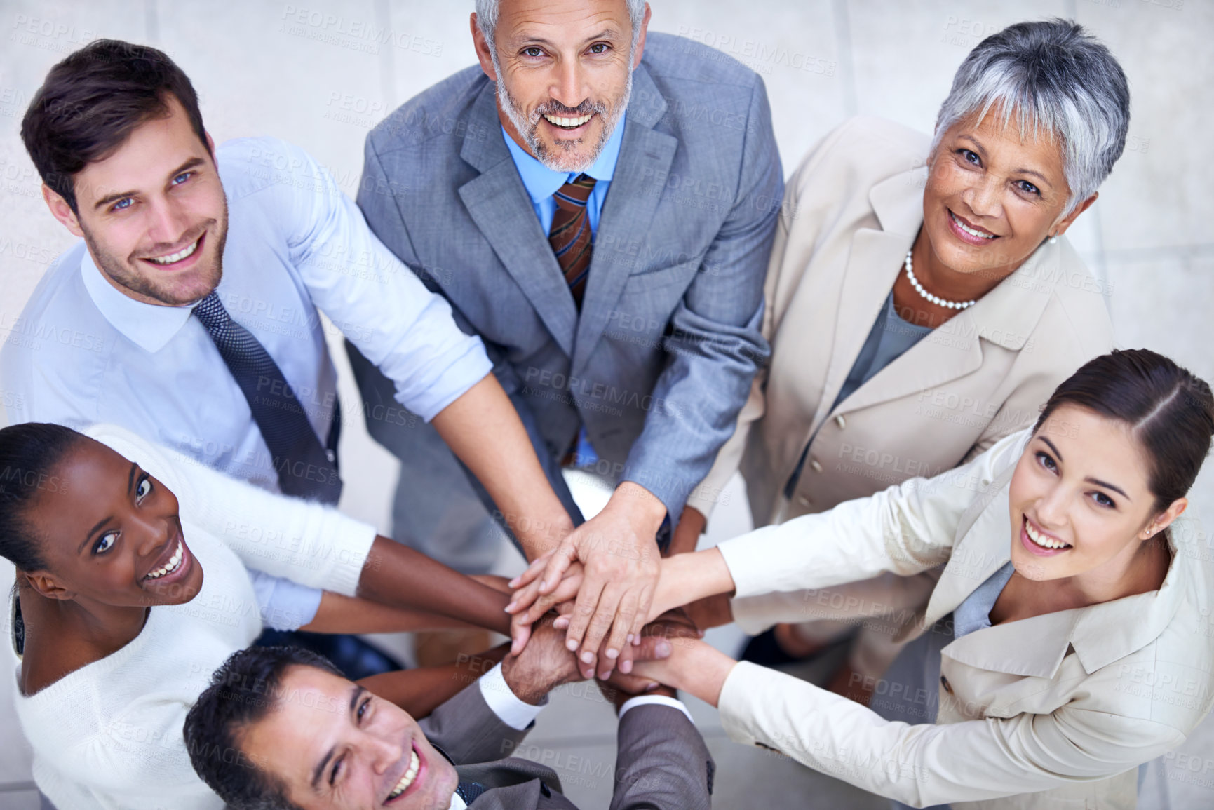 Buy stock photo Portrait, above or business people with hands in stack for mission goals, collaboration or teamwork. Team building, smile or happy employees in meeting with support, solidarity or group motivation