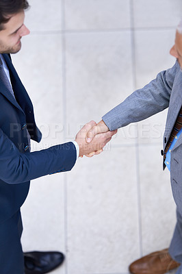 Buy stock photo Above, business people and shaking hands for deal, collaboration or b2b partnership agreement for consultant. Top view, introduction and handshake of team for greeting, thank you or welcome to office