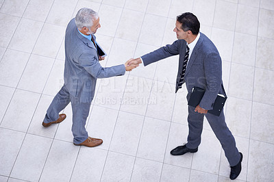 Buy stock photo Top view of business people, CEO or shaking hands for hiring, collaboration or teamwork. Handshake, partnership or proud employee in corporate agreement with meeting success, welcome or thank you