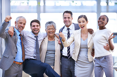 Buy stock photo Cropped shot of a group of colleagues celebrating in the office