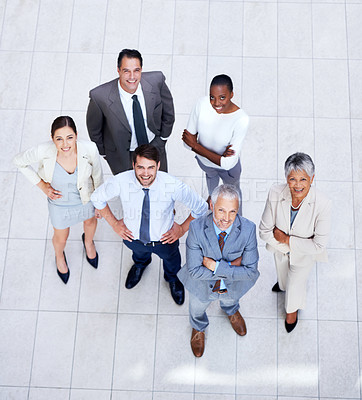 Buy stock photo High angle portrait of a group of confident businesspeople standing indoors