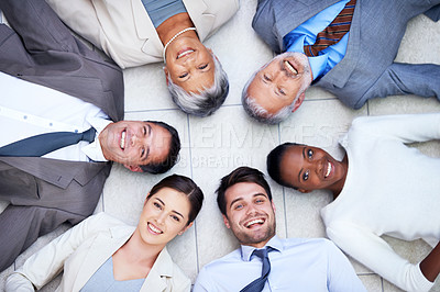 Buy stock photo Floor, circle and portrait of team with smile for support, collaboration and solidarity. Professional employees, happy and diversity in office with trust, unity and partnership together from above