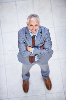 Buy stock photo High angle, portrait and happy man with arms crossed in business or office with confidence and pride. Professional, entrepreneur and above person in lobby excited for morning in London at workplace