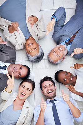 Buy stock photo Circle, portrait and business people on floor with thumbs up for team building, agreement and support. Professional employees, diversity and gesture for motivation, success and partnership from above