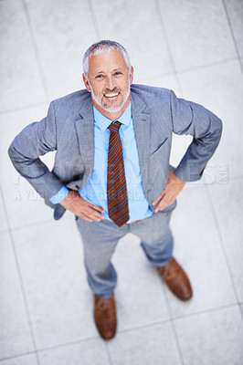 Buy stock photo Happy, portrait and high angle of man in business or office with professional confidence and pride. Above, entrepreneur and mature person smile in lobby excited for morning in London at workplace