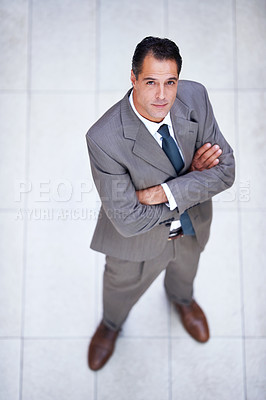 Buy stock photo Man, portrait and high angle with arms crossed in business or office with professional confidence and pride. Above, entrepreneur and person in lobby to start morning in London at corporate workplace